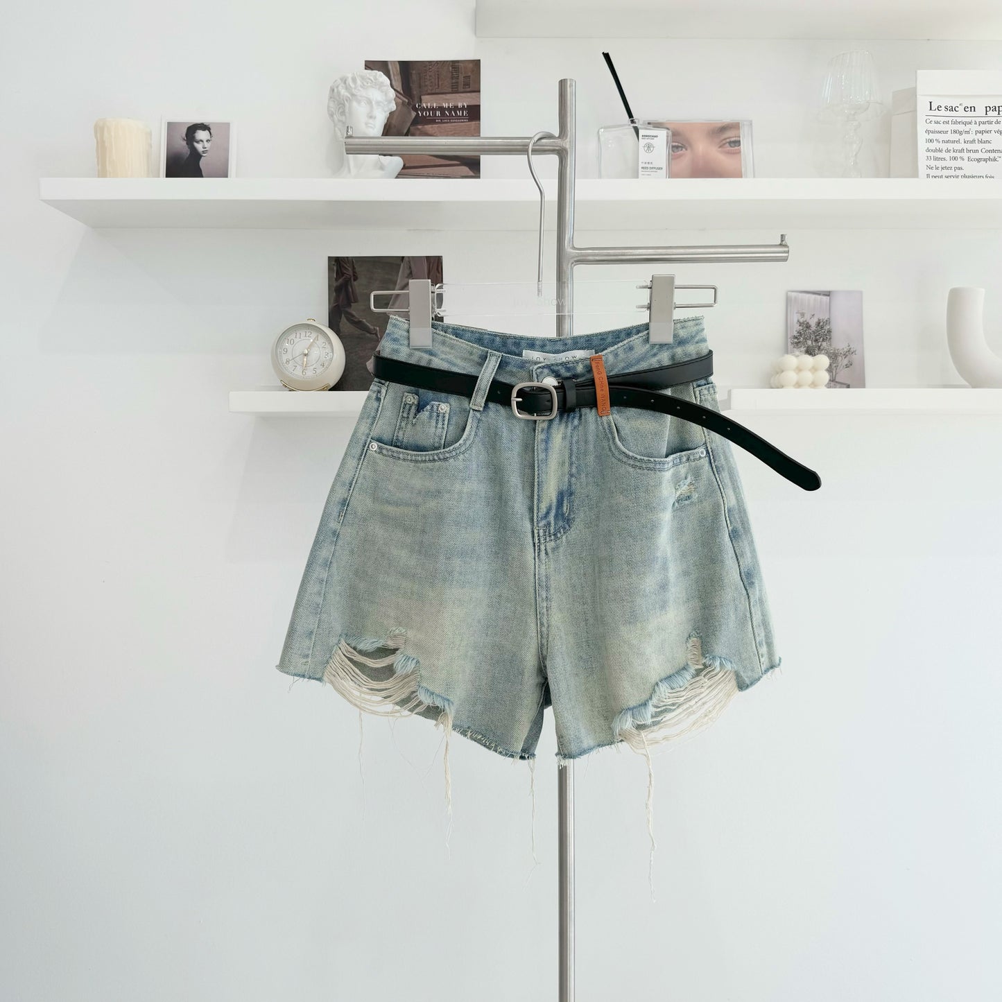 Belted high-waisted denim shorts