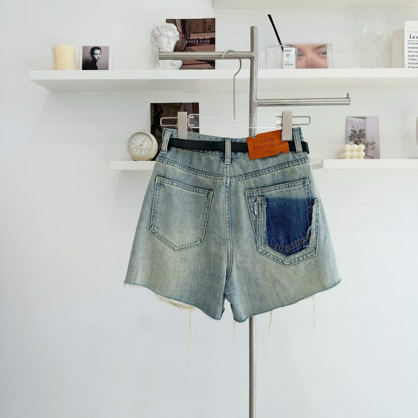 Belted high-waisted denim shorts