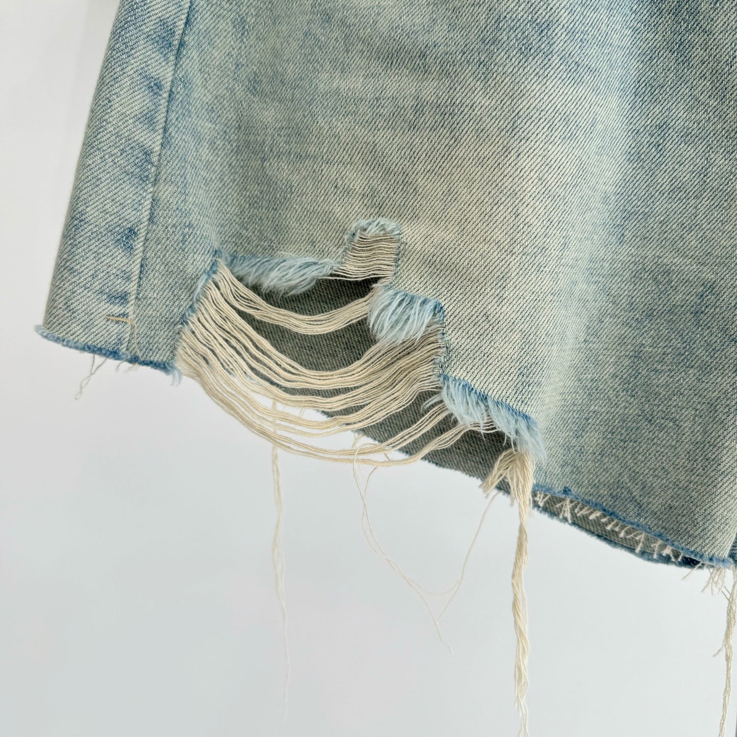 Belted high-waisted denim shorts