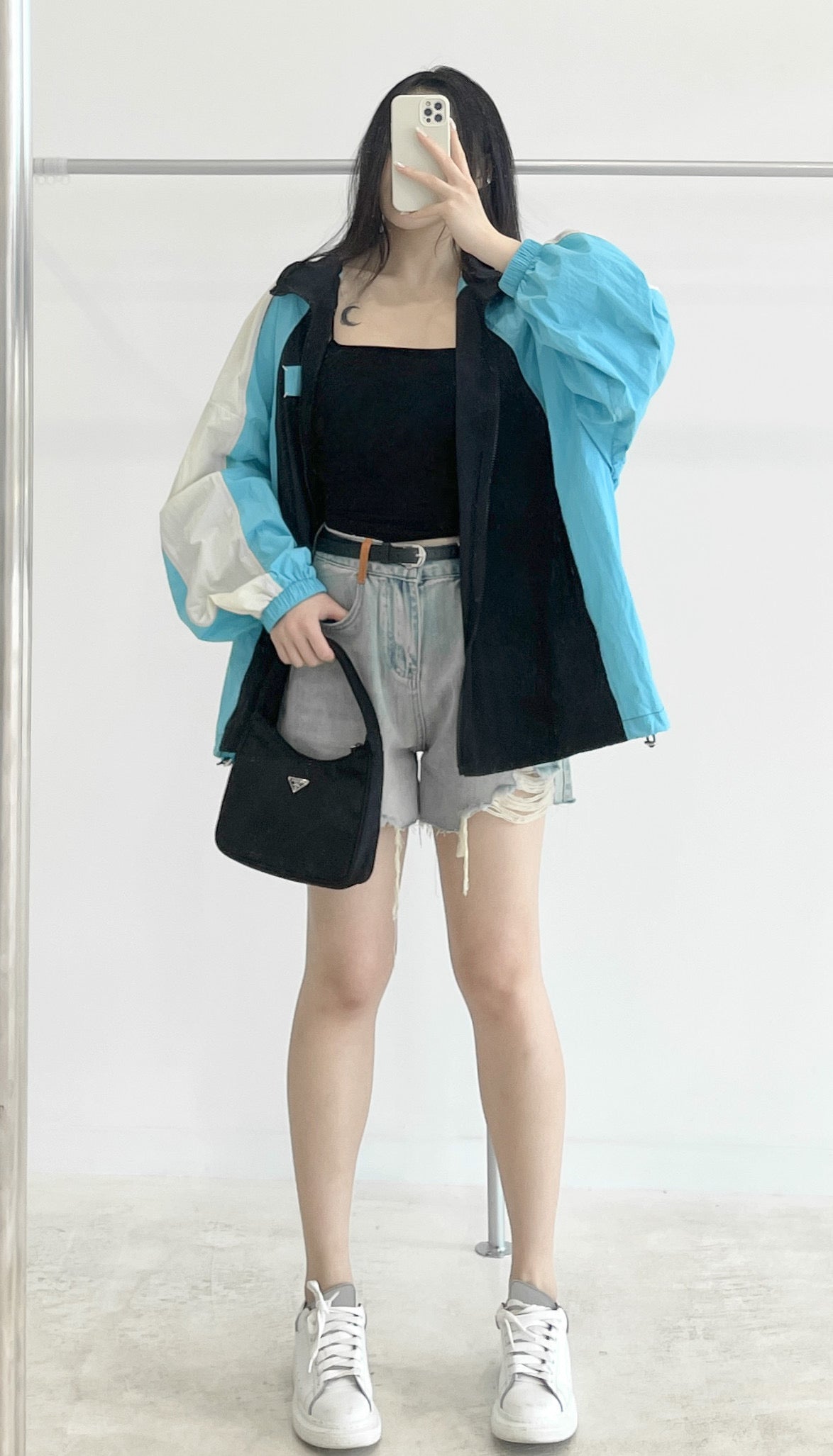 Belted high-waisted denim shorts