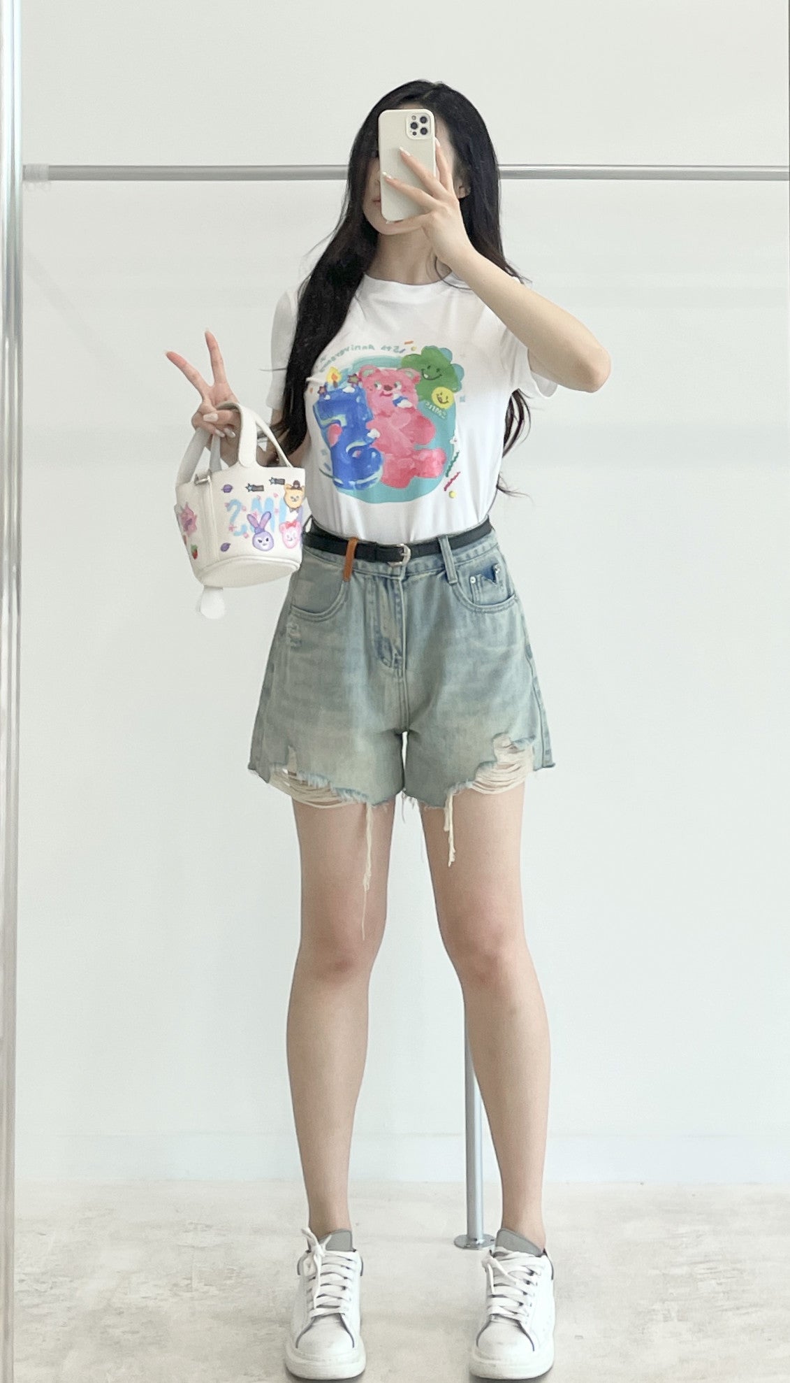 Belted high-waisted denim shorts