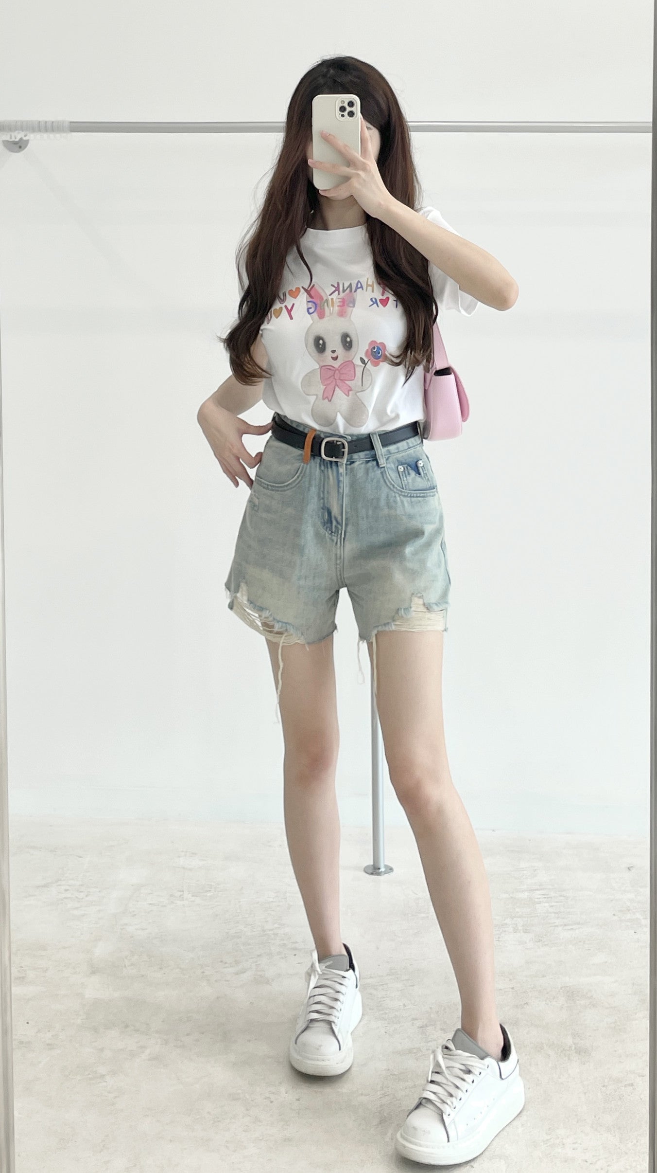 Belted high-waisted denim shorts