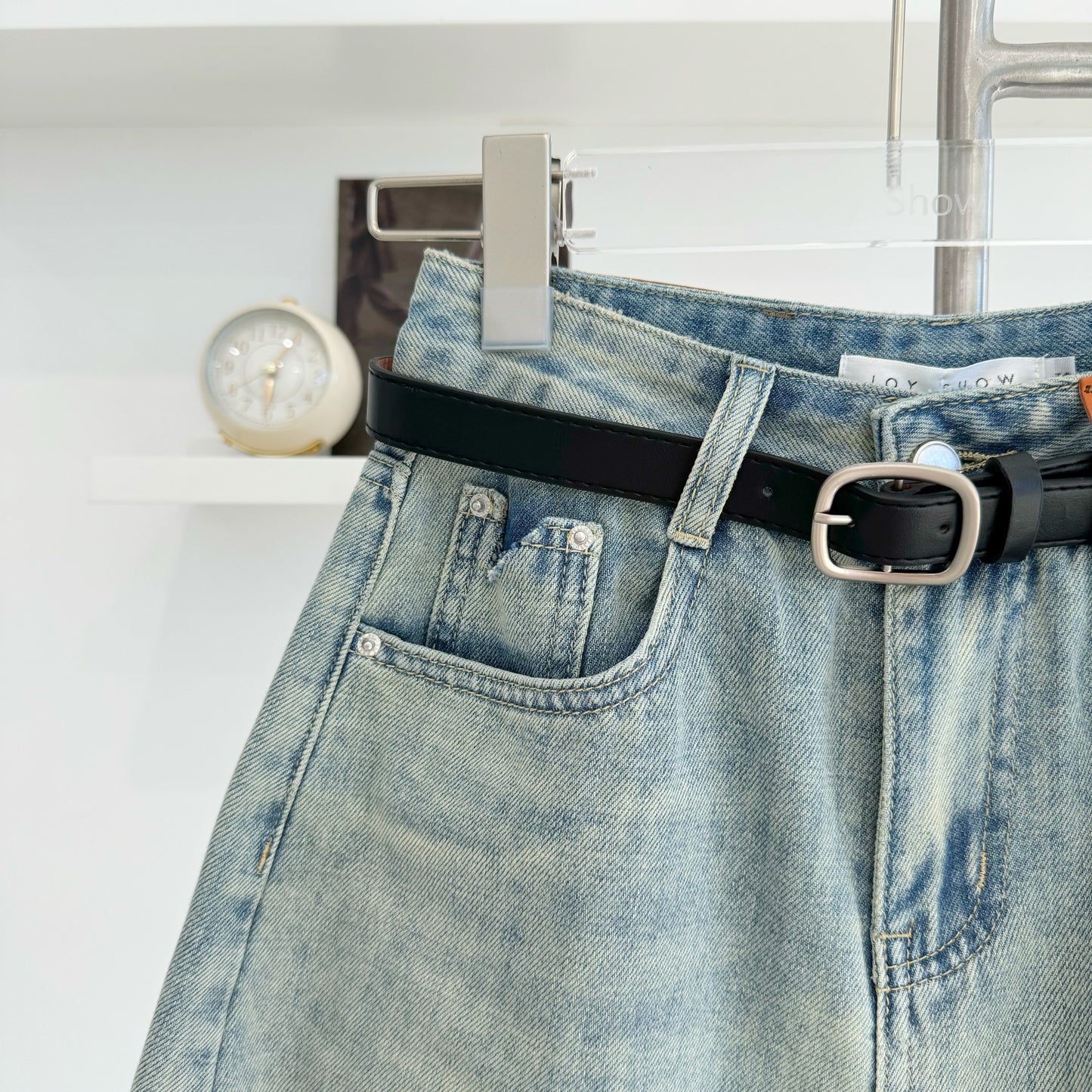 Belted high-waisted denim shorts