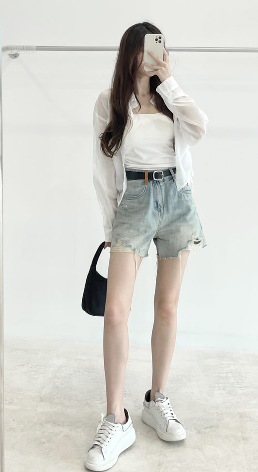 Belted high-waisted denim shorts