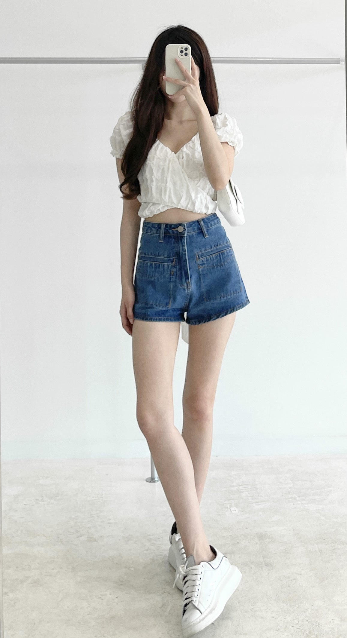 High-waisted stretch denim shorts